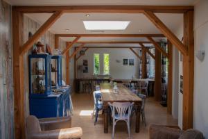 a dining room with a table and chairs at B&B Aangenaam - Olde Horst Diever in Diever