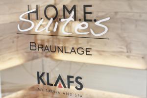 a book cover of home bitesanches blondeness with a brick wall at HOME Suites Maisonette mit Sauna in Braunlage