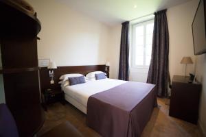 Postel nebo postele na pokoji v ubytování Hotel La Beauze