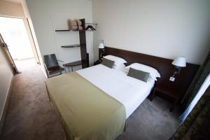 Postel nebo postele na pokoji v ubytování Hotel La Beauze