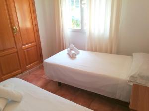 Łóżko lub łóżka w pokoju w obiekcie 0315 Monteverde Limon