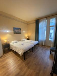 Tempat tidur dalam kamar di Chez Benjamin - Centre d'Azay le Rideau