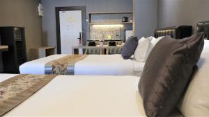 Voodi või voodid majutusasutuse KTK Pattaya Hotel & Residence toas