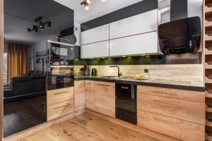 Kuchyňa alebo kuchynka v ubytovaní Apartamenty Na Wydmach by Renters
