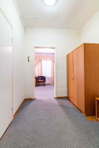 an empty room with a door and a table at Гостиница Большой Урал in Yekaterinburg