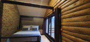 Ένα ή περισσότερα κρεβάτια σε δωμάτιο στο Villa Vrelo Bosne