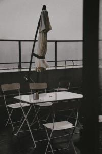 a table and two chairs and a umbrella on a boat at Ma Cherie Homestay in Shanghai