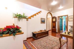 a living room with a stair case and a table at Palazzo Gradenigo in Venice