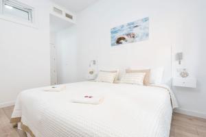 Posteľ alebo postele v izbe v ubytovaní Pinzon Apartment in Malaga by Solaga Holiday Homes