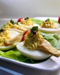 a plate of food with eggs and lettuce at THE ONE Boutique Hotel & SPA Rome in Rome