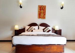 Cama o camas de una habitación en Royal Kandyan Hotel