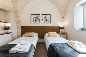 A bed or beds in a room at Trulli in Vigna