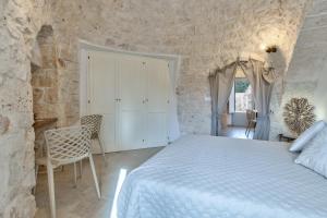 A bed or beds in a room at Trulli in Vigna