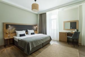 Кровать или кровати в номере Отель Британика