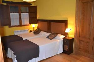 A bed or beds in a room at Apartamento La Casa del Abuelo Justo