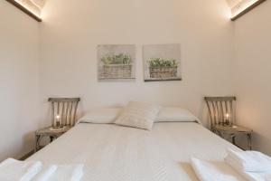 A bed or beds in a room at Trulli in Vigna
