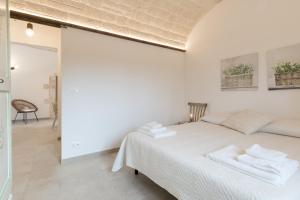 A bed or beds in a room at Trulli in Vigna
