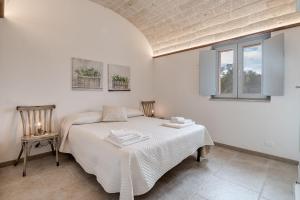 A bed or beds in a room at Trulli in Vigna