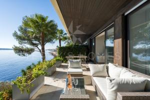 a view of the water from the patio of a house at ADRIANA by Terry's Homes WATERFRONT SEAVIEW BEACH in Cannes