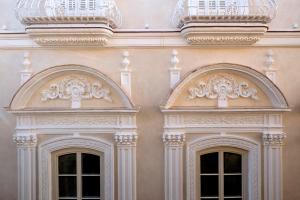 two doors on the side of a building at Áurea Casa Palacio Sagasta by Eurostars Hotel Company in Cádiz