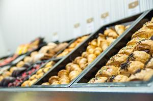 a bunch of pastries on display in a bakery at Áurea Casa Palacio Sagasta by Eurostars Hotel Company in Cádiz