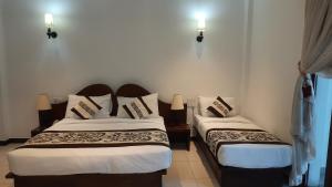 Cama o camas de una habitación en Royal Kandyan Hotel