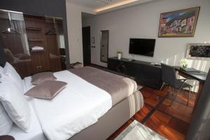 TV a/nebo společenská místnost v ubytování Solun Hotel & SPA