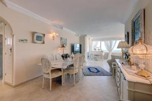 a dining room with a table and chairs at Malaga Paradise Home in Torremolinos