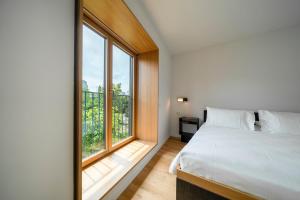 Krevet ili kreveti u jedinici u okviru objekta SET Hotel.Residence by Teufelhof Basel