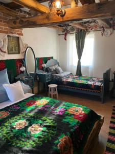A bed or beds in a room at Casa Cezara