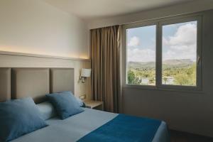 Posteľ alebo postele v izbe v ubytovaní Hotel Ivory Playa Sports & Spa