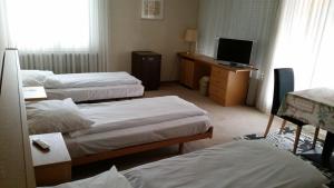 Postel nebo postele na pokoji v ubytování Hotel Mare & Monti