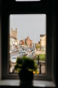 a view of a city street from a window at Central Apartment Newcastle in Newcastle