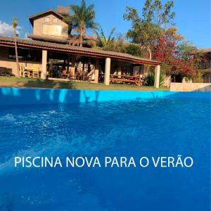 a picture of a resort with the words pisina nova parapa o at Pousada Rota dos Pássaros in São Bento do Sapucaí