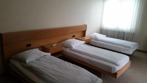 Postel nebo postele na pokoji v ubytování Hotel Mare & Monti
