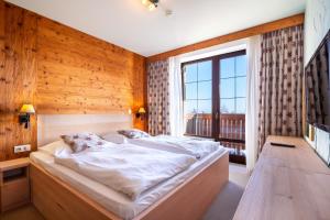 Ein Bett oder Betten in einem Zimmer der Unterkunft Kukučka Lomnica - Tatranská Lomnica