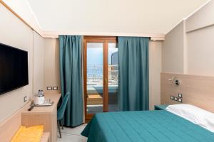 Postel nebo postele na pokoji v ubytování Hotel Porto Roca