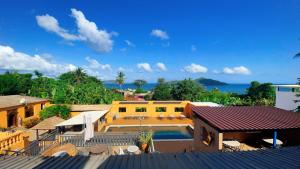 a view of a house with a swimming pool at Le Passamainty Lodge in Mamoudzou