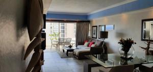 a living room with a couch and a table at 305 Ben Siesta in Durban