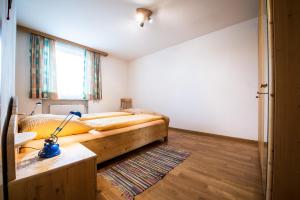 A bed or beds in a room at Issingerhof App 1 Még 6 kép