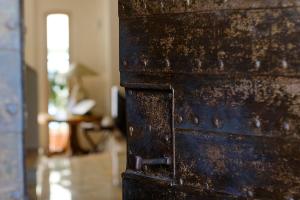 a close up of a wooden door in a room at miKasa Agua Amarga & SPA in Agua Amarga