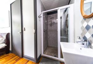 a bathroom with a shower and a sink at Wolf Unit in Pretoria +58 photos