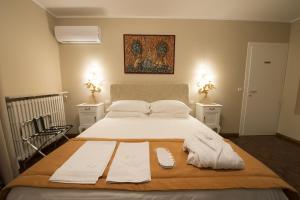 Postel nebo postele na pokoji v ubytování Villa Jasmine B&B