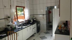 A cozinha ou cozinha compacta de PARAISO DO ALEXANDRE para 15 hóspedes