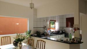 A cozinha ou cozinha compacta de PARAISO DO ALEXANDRE para 15 hóspedes