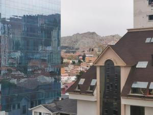 a view of a city with buildings and a mountain at Nido 906 in La Paz