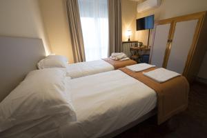 Postel nebo postele na pokoji v ubytování Villa Jasmine B&B