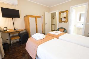 Postel nebo postele na pokoji v ubytování Villa Jasmine B&B