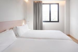 Posteľ alebo postele v izbe v ubytovaní B&B HOTEL Málaga Centro