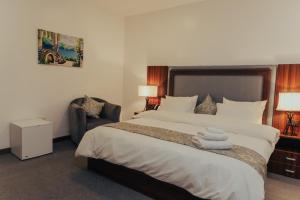 A bed or beds in a room at Sinclair Lake Chad